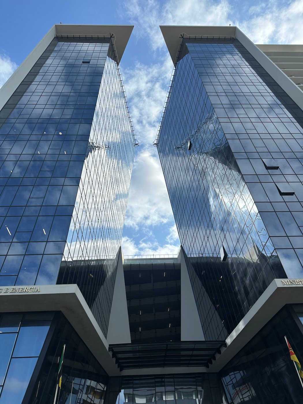 Glass office towers reflecting the sky