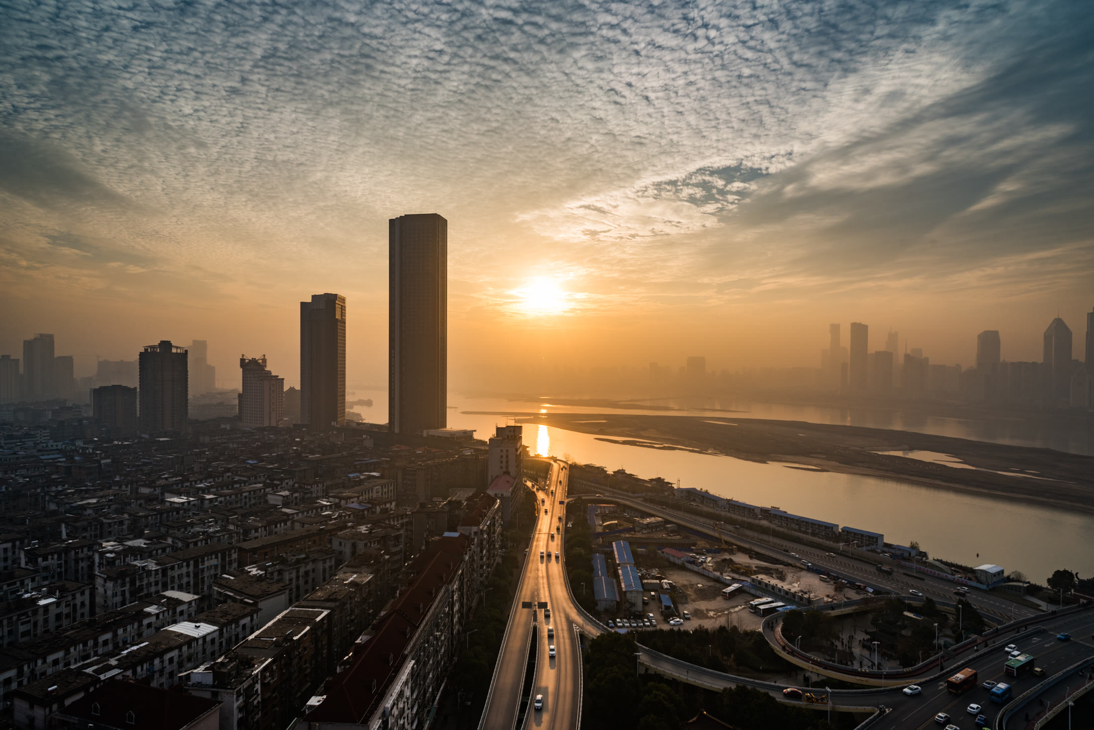 City skyline at sunrise over the river